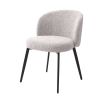 A beautiful set of dining chairs with a gorgeous grey boucle upholstery and black tapered legs 
