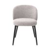 A beautiful set of dining chairs with a gorgeous grey boucle upholstery and black tapered legs 