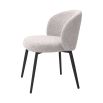 A beautiful set of dining chairs with a gorgeous grey boucle upholstery and black tapered legs 