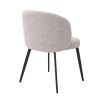 A beautiful set of dining chairs with a gorgeous grey boucle upholstery and black tapered legs 