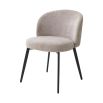 A set of chic dining chairs from Eichholtz with a gorgeous grey upholstery and black tapered legs 