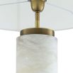 A gorgeous table lamp with brass accents and round shade