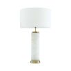 A gorgeous table lamp with brass accents and round shade