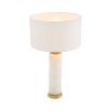 A gorgeous table lamp with brass accents and round shade