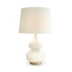 An alabaster table lamp with an hourglass silhouette and white shade.