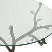 A unique and stylish centre table by Eichholtz with a clear, round table top and a bronze finished, branch-like tripod base