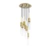 A stylish statement chandelier by Eichholtz with glamorous, cylindrical ribbed glass shades with an antique brass finish 
