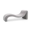 A contemporary chaise longue by Eichholtz with a curved design and beautiful bouclé grey upholstery