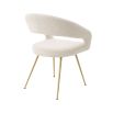 A glamorous dining chair in a range of finishes with brass tapered legs