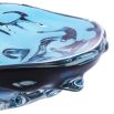 Small blue glass bowl with elegant curves