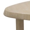 A rounded triangular coffee table with a natural veneer