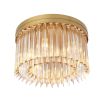 A luxurious, Art Deco inspired ceiling light by Eichholtz with an antique brass finish and rows of clear glass rods