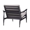 A contemporary chair by Eichholtz with a black finished wooden frame and a beautiful boucle grey upholstery 