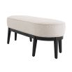 An elegant bench by Eichholtz with a luxury bouclé cream upholstery and beautiful black finished frame
