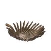 A glamorous tray by Eichholtz with a palm leaf design and vintage brass finish 