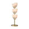 A luxurious, candelabra style side lamp crafted from alabaster with an antique brass finish