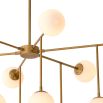 chandelier with sleek brass-brushed iron bars and white glass shades