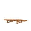 A sophisticated and slatted natural teak outdoor coffee table by Eichholtz