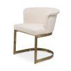Modern, boucle upholstered dining chair with brushed brass base