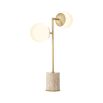 Striking table lamp with round lampshades and travertine base