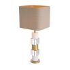 A stylish table lamp by Eichholtz featuring a luxury linen mix shade and marble, crystal glass base with an antique brass finish 