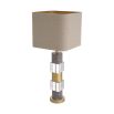 An elegant table lamp featuring a linen mix shade with a marble, crystal glass base and antique brass finish 