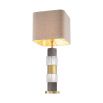 An elegant table lamp featuring a linen mix shade with a marble, crystal glass base and antique brass finish 