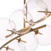 A stylish statement ceiling light by Eichholtz with clear glass spherical shades and an antique brass finish 