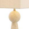 A stylish side lamp by Eichholtz with a travertine finish and boucle shade