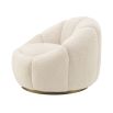 A beautiful swivel chair by Eichholtz with gentle curves, a soft-touch teddy upholstery and a brushed brass base