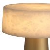 A charming side lamp by Eichholtz with an alabaster shade and antique brass finish