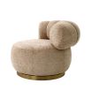 Dazzling swivel chair with brass base and sumptuous soft fabric