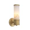 A glamourous wall lamp by Eichholtz with a cylindrical alabaster shade and brushed brass base