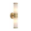 A luxury double wall lamp by Eichholtz with two bulbs, a translucent alabaster shade and brushed brass details