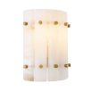 A striking wall lamp by Eichholtz with translucent alabaster panels and brass details