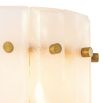 A striking wall lamp by Eichholtz with translucent alabaster panels and brass details