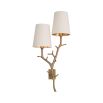 A luxury wall lamp by Eichholtz with a nature, branch inspired stem with a beautiful vintage brass finish and two off white shades