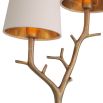 A luxury wall lamp by Eichholtz with a nature, branch inspired stem with a beautiful vintage brass finish and two off white shades