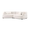 A contemporary sofa by Eichholtz with sumptuously soft curves and a luxury Lyssa Off-White upholstery