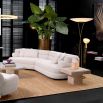 A contemporary sofa by Eichholtz with sumptuously soft curves and a luxury Lyssa Off-White upholstery