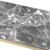 A stylish coffee table with cross-details and a grey marble surface 