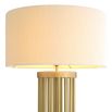 A stylish floor lamp by Eichholtz with a marble base, antique brass structure and finished with a contemporary boucle shade