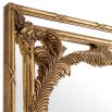 A hand-crafted French-style wall mirror by Eichholtz with an antique gold finish