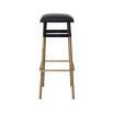 A stylish bar stool by Eichholtz with a black leather and vintage brass finish