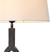 A sophisticated side lamp by Eichholtz with a white fabric shade and hammered bronze base 