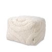 Cosy wool pouffe with elegant flowing curves