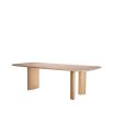 A natural oak veneer dining table by Eichholtz featuring subtle asymmetrical table legs