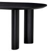 A luxury black dining table by Eichholtz with offset playful legs