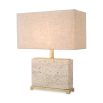 Striking, modern travertine table lamp with brass accents