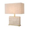 Striking, modern travertine table lamp with brass accents